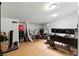 Versatile basement area with wood-look flooring, suitable for a home office or recreational space at 620 Painted Cloud Pl, Las Vegas, NV 89144