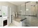 Bathroom featuring a soaking tub and a glass walk-in shower at 620 Painted Cloud Pl, Las Vegas, NV 89144