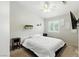 Light filled bedroom with a ceiling fan and carpet floors at 620 Painted Cloud Pl, Las Vegas, NV 89144