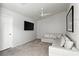 Upstairs Bonus room featuring a ceiling fan and a large sectional sofa at 620 Painted Cloud Pl, Las Vegas, NV 89144
