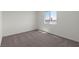 Carpeted bedroom offering a bright window with a view at 6246 Blood Lily Ave, Las Vegas, NV 89122