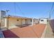 Wide view of the backyard of a single Gathering home with a covered patio at 6317 Alta Dr, Las Vegas, NV 89107