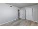 Bedroom featuring wood-look floors, closet and a hallway at 6317 Alta Dr, Las Vegas, NV 89107