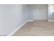 Neutral bedroom showcasing modern wood-look tile flooring and a spacious closet at 6317 Alta Dr, Las Vegas, NV 89107