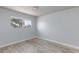 Bright bedroom with laminate flooring and a large window providing natural light at 6317 Alta Dr, Las Vegas, NV 89107