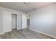 Bedroom with laminate flooring, closet, and ensuite bathroom at 6317 Alta Dr, Las Vegas, NV 89107