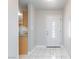 Bright entryway with white marble floors and a decorative front door at 6317 Alta Dr, Las Vegas, NV 89107