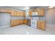 Updated kitchen with modern stainless steel appliances, tile backsplash and light wood cabinetry at 6317 Alta Dr, Las Vegas, NV 89107