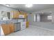 Updated kitchen with stainless appliances, granite counters, gray backsplash and marble flooring at 6317 Alta Dr, Las Vegas, NV 89107