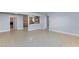 Spacious living area open to the kitchen, featuring lots of natural light and laminate floors at 6317 Alta Dr, Las Vegas, NV 89107