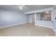 Open-concept living space featuring modern flooring, light gray walls, and an open kitchen at 6317 Alta Dr, Las Vegas, NV 89107