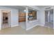 Bright living area with laminate floors that seamlessly blends into the updated kitchen at 6317 Alta Dr, Las Vegas, NV 89107