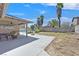 Backyard featuring a covered patio, a pool, and palm trees at 7113 Carrondale Way, Las Vegas, NV 89128