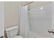 Small bathroom with a tiled shower and tub, including a white shower curtain at 7113 Carrondale Way, Las Vegas, NV 89128