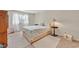Comfortable bedroom featuring a well-made bed, two carpets, and natural light at 7113 Carrondale Way, Las Vegas, NV 89128