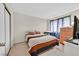 Comfortable bedroom with a closet, dresser, TV, and blackout curtains at 7113 Carrondale Way, Las Vegas, NV 89128