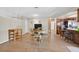 Dining area with seating for four adjacent to the kitchen and living space at 7113 Carrondale Way, Las Vegas, NV 89128