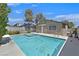 Backyard showcasing a refreshing pool with integrated spa, perfect for relaxation and entertainment at 7113 Carrondale Way, Las Vegas, NV 89128