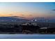 Enjoy stunning Las Vegas city views from this modern home with an infinity pool overlooking the vibrant skyline at 720 Dragon Peak Dr, Henderson, NV 89012