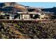 Contemporary luxury home featuring expansive windows, clean lines, and a hillside setting at 720 Dragon Peak Dr, Henderson, NV 89012