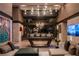 Spacious game room with a pool table, comfortable seating, and contemporary lighting at 720 Dragon Peak Dr, Henderson, NV 89012