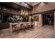 Modern kitchen showcasing a large island with seating, pendant lighting, and decorative art at 720 Dragon Peak Dr, Henderson, NV 89012