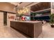 Modern kitchen island with seating, wood cabinetry, and sleek countertops, ideal for casual dining at 720 Dragon Peak Dr, Henderson, NV 89012