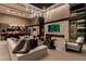 Spacious living room with modern fireplace, stylish furniture, and a seamless open-concept design at 720 Dragon Peak Dr, Henderson, NV 89012
