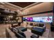 Inviting living room with a game table, TV wall, and comfortable sectional sofa at 720 Dragon Peak Dr, Henderson, NV 89012