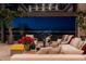 Modern living room with chic furniture, plants and expansive windows showcasing panoramic Las Vegas city views at 720 Dragon Peak Dr, Henderson, NV 89012