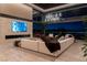 Modern living room with sleek design, large windows, and expansive views of the Las Vegas skyline at 720 Dragon Peak Dr, Henderson, NV 89012