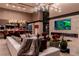 Open concept living area featuring a fireplace, modern lighting, and seamless flow to the kitchen at 720 Dragon Peak Dr, Henderson, NV 89012