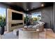 Relaxing living room featuring a fireplace, refreshment bar, and comfortable seating at 720 Dragon Peak Dr, Henderson, NV 89012