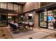 Outdoor dining and living space featuring a grill, dining table, and access to other living spaces at 720 Dragon Peak Dr, Henderson, NV 89012