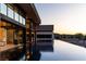 Luxurious infinity pool reflecting the modern home's architecture and serene landscape at 720 Dragon Peak Dr, Henderson, NV 89012