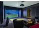 Recreation room with golf simulator, comfortable seating, and custom shelving and accents at 720 Dragon Peak Dr, Henderson, NV 89012