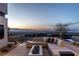 Modern outdoor patio area, complete with seating and a stunning city view at 720 Dragon Peak Dr, Henderson, NV 89012