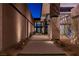 Modern walkway leading to the residence featuring clean lines, desert landscaping, and architectural lighting at 720 Dragon Peak Dr, Henderson, NV 89012