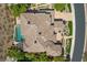 Aerial view of a luxury home with a tile roof, desert landscaping, pool, and backyard area at 73 Kittansett Loop, Henderson, NV 89052