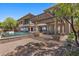 Expansive backyard with a pool, covered patio, and lush landscaping, perfect for outdoor entertaining at 73 Kittansett Loop, Henderson, NV 89052