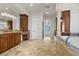 Spacious bathroom featuring marble floors, dual sinks, a tub, and dark wood cabinetry at 73 Kittansett Loop, Henderson, NV 89052