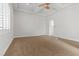 A bright, carpeted bedroom with ample space at 73 Kittansett Loop, Henderson, NV 89052