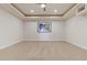 Spacious carpeted bedroom with recessed lighting and tray ceiling detail at 73 Kittansett Loop, Henderson, NV 89052