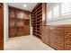 Walk-in closet with custom shelving and drawers for organized storage at 73 Kittansett Loop, Henderson, NV 89052