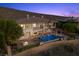 Elegant home showcasing a pool, hot tub, and firepit with mountain views at 73 Kittansett Loop, Henderson, NV 89052