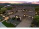 Luxury home aerial view showcasing desert landscaping, a circular driveway, and a three car garage at 73 Kittansett Loop, Henderson, NV 89052