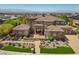 Stunning home with a beautiful desert landscape, detailed facade, and a circular driveway at 73 Kittansett Loop, Henderson, NV 89052
