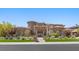Elegant single-Gathering home showcasing lush landscaping and a circular stone accent at 73 Kittansett Loop, Henderson, NV 89052