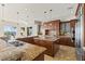 Open kitchen featuring two islands, granite countertops, and stainless steel appliances at 73 Kittansett Loop, Henderson, NV 89052