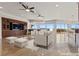 Bright living room with built-in cabinetry, ceiling fans, and a view at 73 Kittansett Loop, Henderson, NV 89052